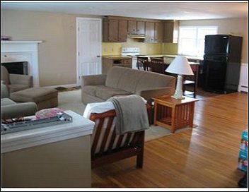 Wall between living room and kitchen removed creating open living space.